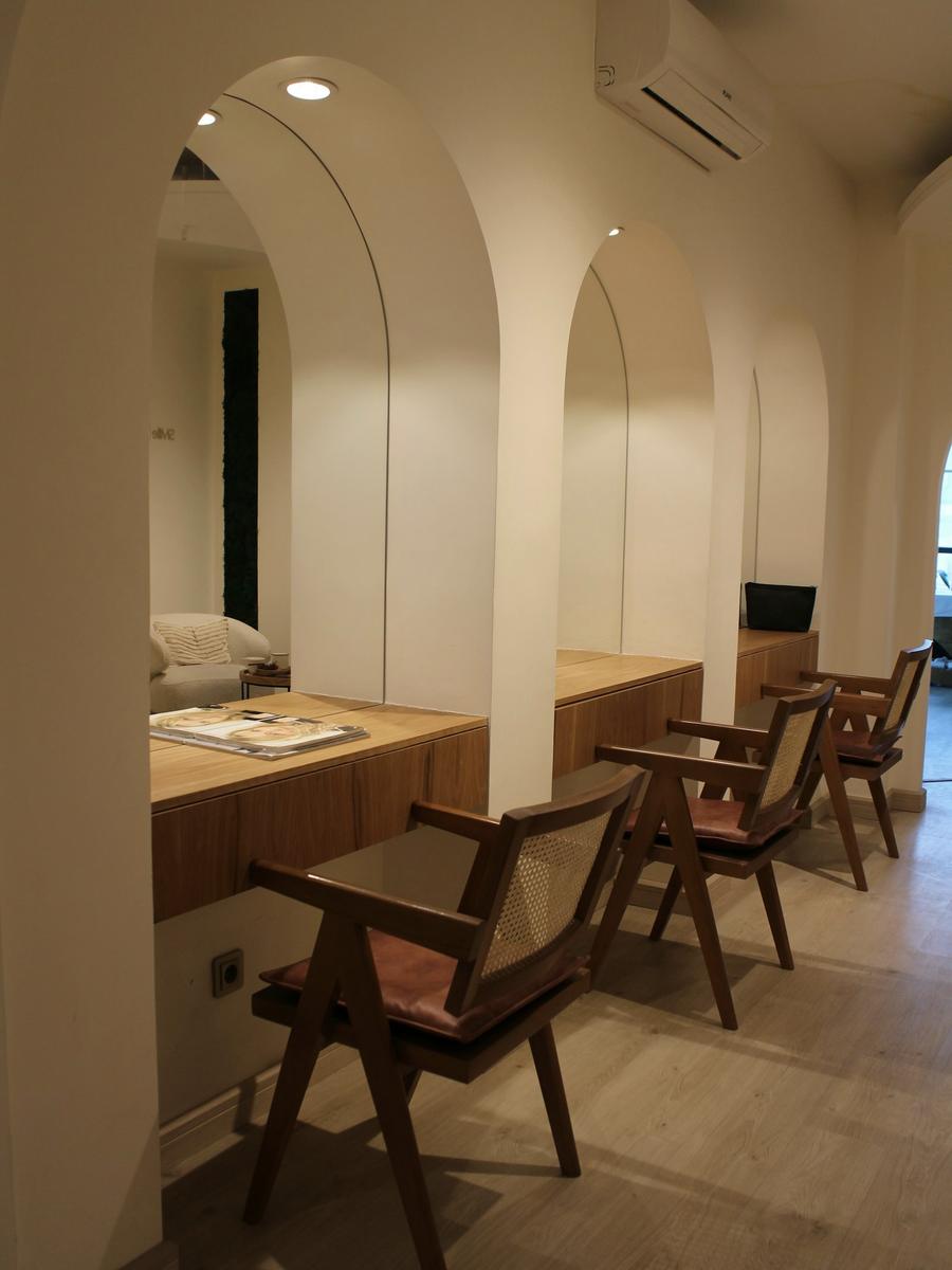 Arched corridor and consultation seating in a clinic
