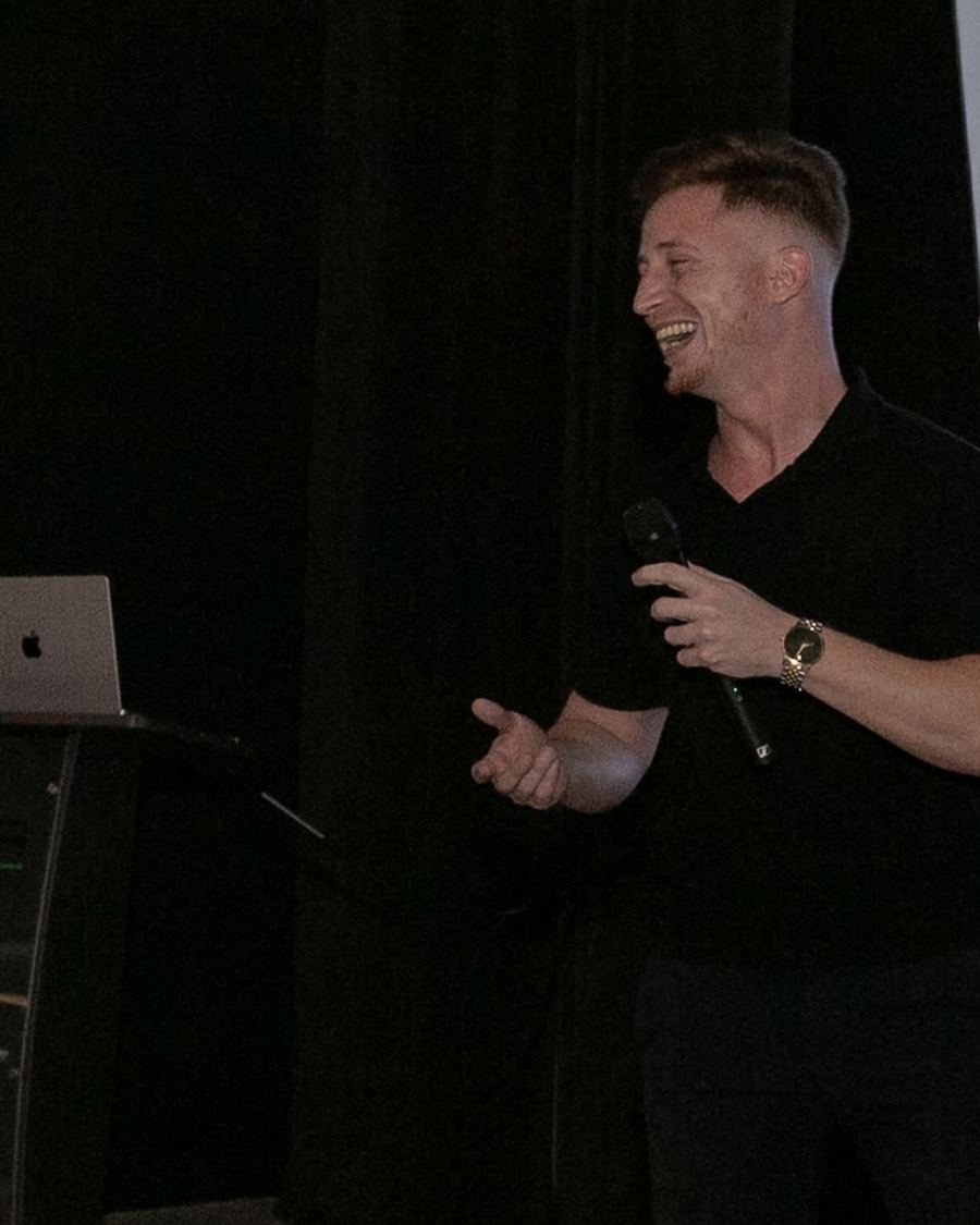 Alon, founder of Patient Bureau, speaking on stage